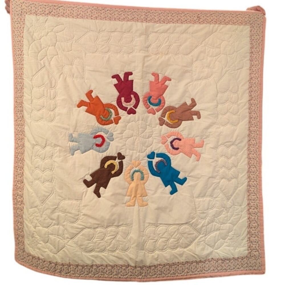 Small Homemade Complete Quilt with People Holding Hearts